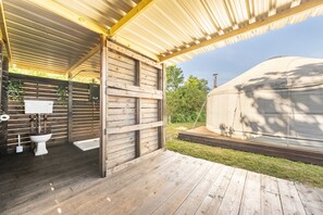 Relax in a serene outdoor space with a covered deck and a spacious gazebo.