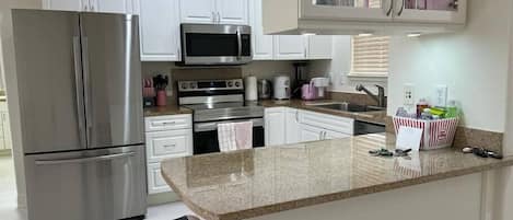 Microwave, stovetop, dishwasher, coffee/tea maker