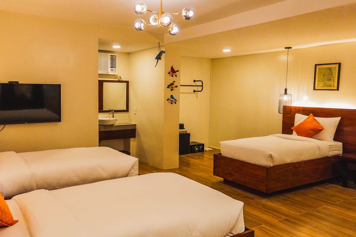 Family Room, 3 Single Beds | Individually decorated, individually furnished, desk, free WiFi
