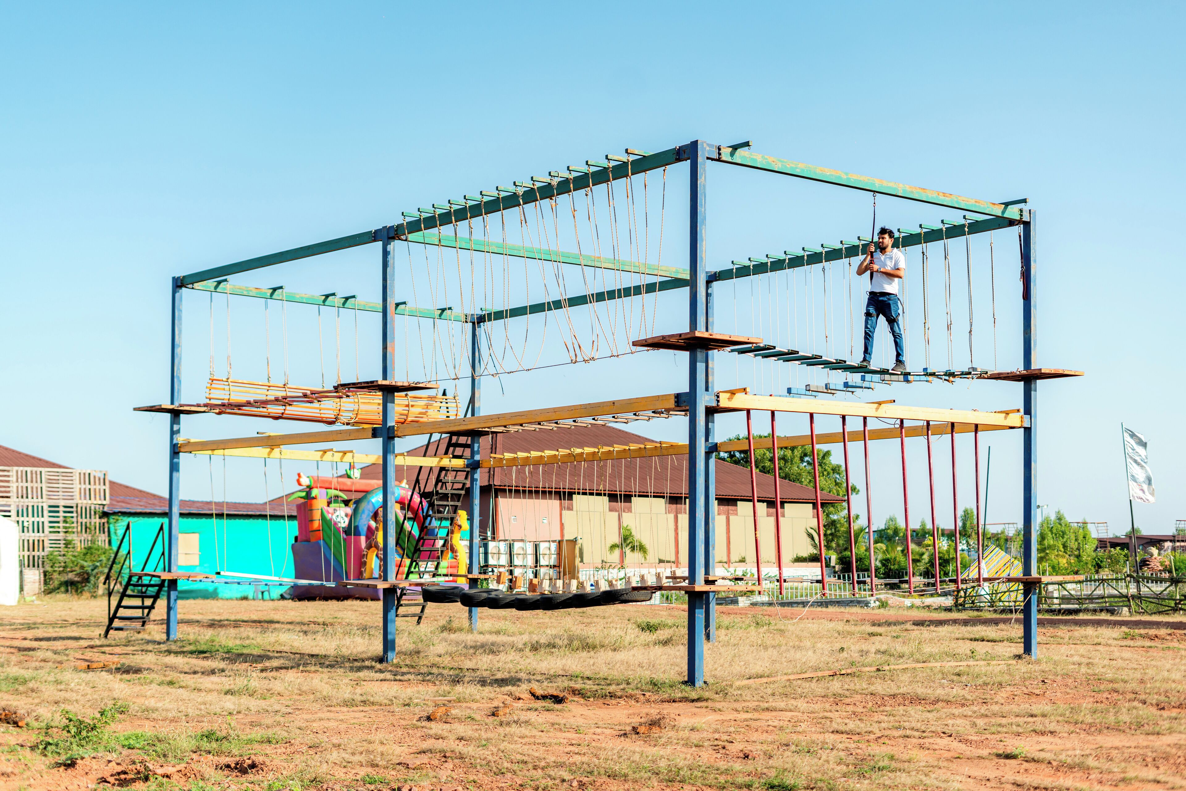 A metal structure with ropes and platforms, possibly for climbing or adventure activities.