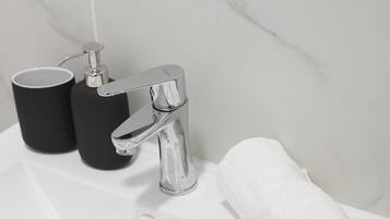 Hair dryer, towels, soap, shampoo