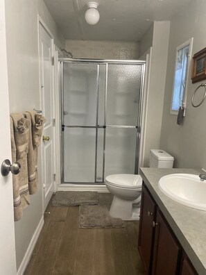 Shower, hair dryer, towels, soap