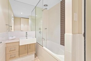 Shower, hair dryer, towels, shampoo