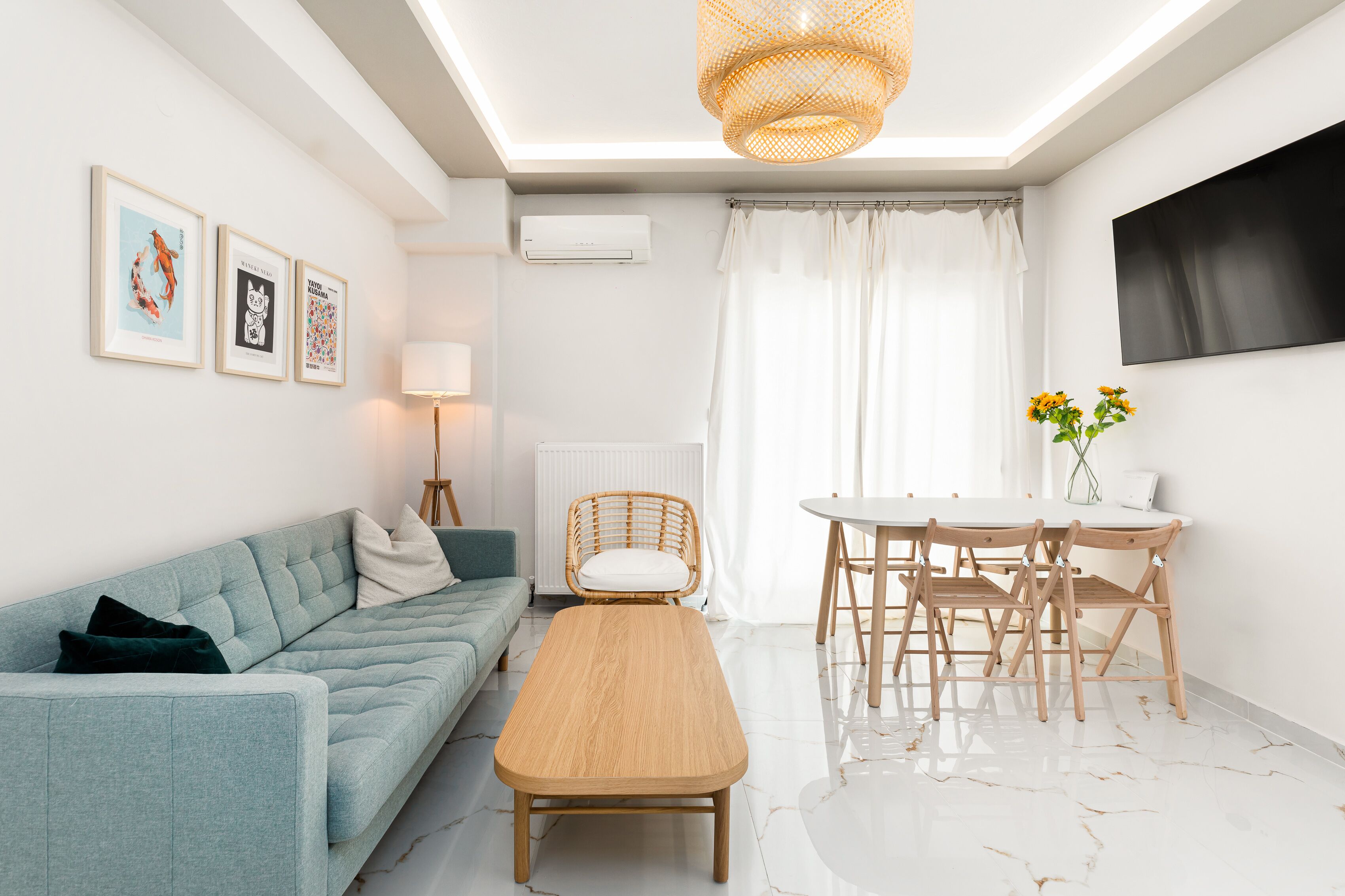 City Apartment | Living area | 40-inch Smart TV with cable channels