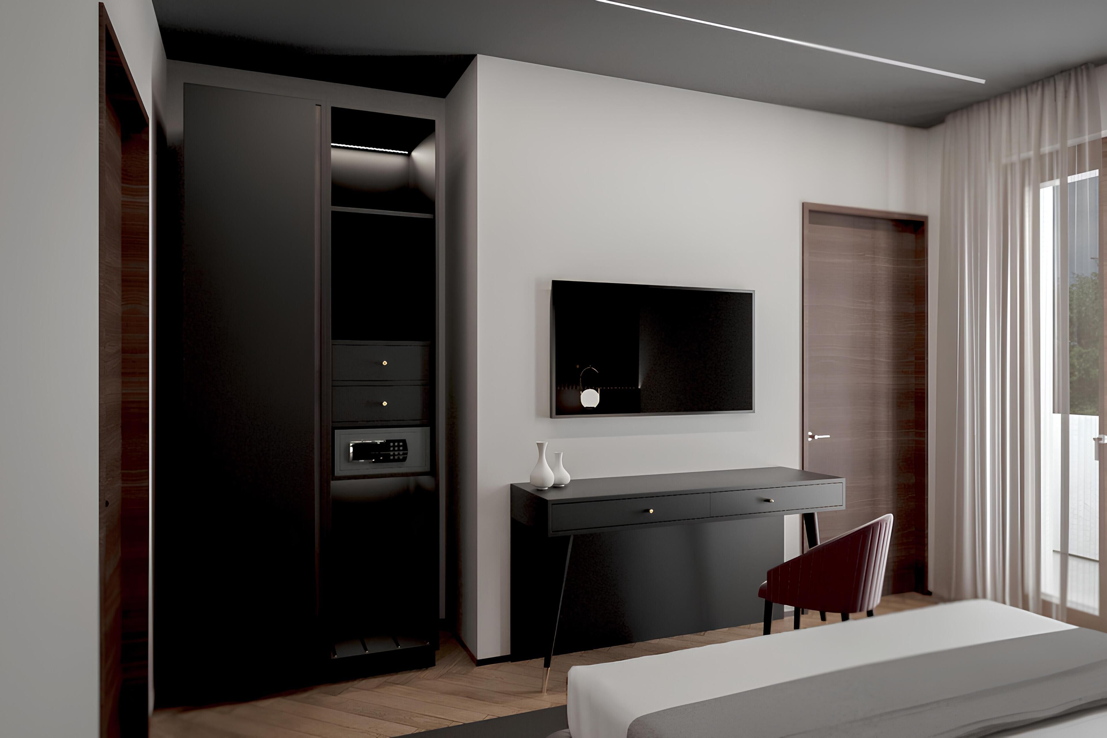 Un dormitorio moderno con cama, escritorio, televisor y armario.