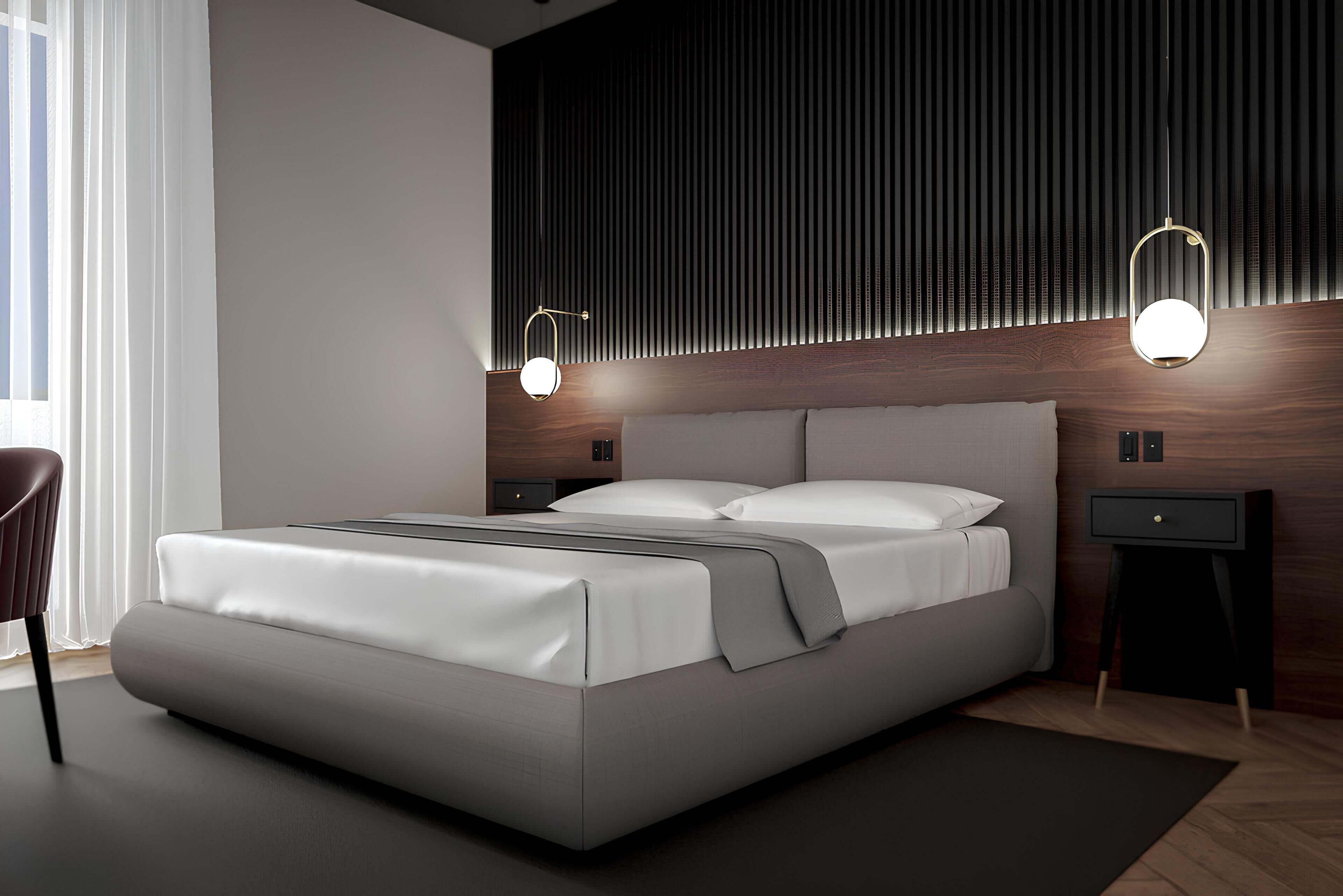 A modern bedroom with a large bed, two bedside tables, and a window with curtains.