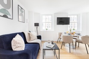 City Apartment | Living area | 40-inch Smart TV with satellite channels - Modern 1BR with Balcony by Soho (London)
