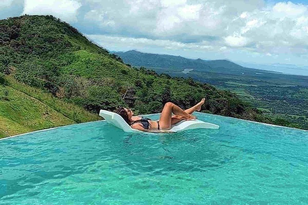 our lotus-petal-shape infinity pool with floating chaises
