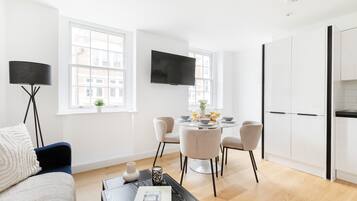 City Apartment | Living area | 40-inch Smart TV with satellite channels