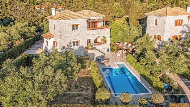 A stone villa with a swimming pool surrounded by lush greenery. - Villa Epavlis - Three Bedroom Villa, Sleeps 6 (Pilos Nestor)