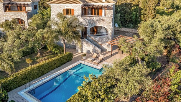 A stone villa with a swimming pool, surrounded by lush greenery and trees. - Villa Petra - Two Bedroom Villa, Sleeps 4 (Pilos Nestor)