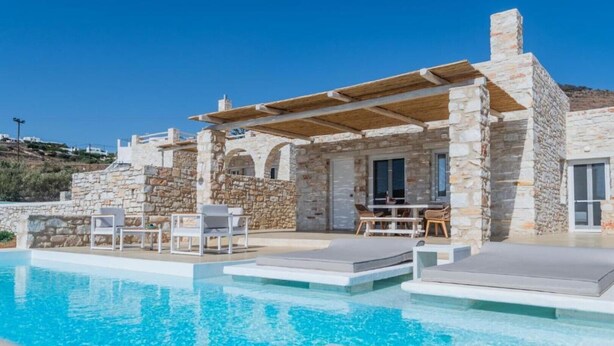A stone villa with a pool, outdoor seating, and a view of the hills. - Aegean Feelings - Luxury Villa Calm with Private Pool close to Piso Livadi Beach (Piso Livadi)