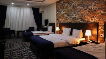 Standard Quadruple Room | Minibar, desk, laptop workspace, soundproofing