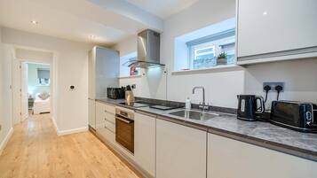 Fridge, high chair, cookware/dishes/utensils