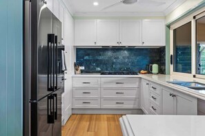 Coffee/tea maker, fridge, microwave, oven