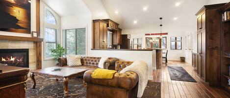 Smart TV, fireplace, books, computer monitors