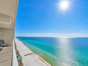 A balcony with a view of a beach and ocean. - Tidewater 2209 "tuscany at Tidewater" (Panama City Beach)