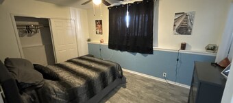 Private 1 bedroom guest suite with private living room, laundry, & kitchenette