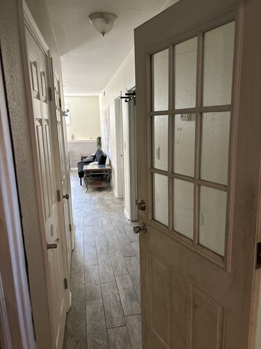 Private 1 bedroom guest suite with private living room, laundry, & kitchenette