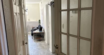 Private 1 bedroom guest suite with private living room, laundry, & kitchenette