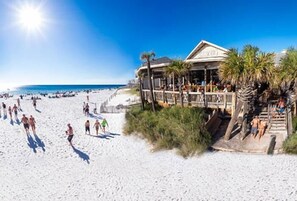 A beachfront hotel with a pool area and a deck overlooking the beach. - Seychelles 209 (Panama City Beach)