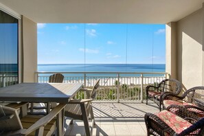 A balcony with a view of the beach and ocean. - Indigo East 604 (Pensacola)