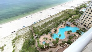 A resort with a beach, a swimming pool, and a view of the ocean. - Indigo East 1702 (Pensacola)