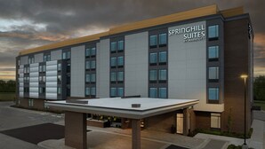 A modern hotel with a flat roof, large windows, and a prominent entrance area with a covered seating area. - Springhill Suites by Marriott Lexington Fritz Farm (Lexington)