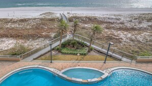 A pool area with a view of the beach and ocean. - Spanish Key 305 (Pensacola)