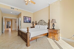 Cozy retreat with a large bed, nightstand, and dresser.