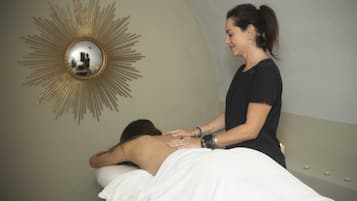 Experience a rejuvenating massage in a serene space with a skilled therapist.