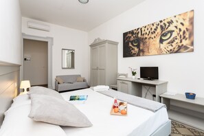 Superior Triple Room | 1 bedroom, down comforters, desk, laptop workspace