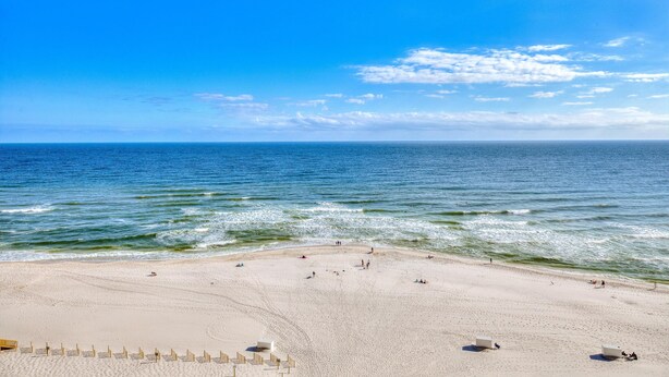 A beach with a clear sky and calm sea. - Beach Colony East 10A (Pensacola)