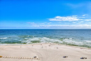 A beach with a clear sky and calm sea. - Beach Colony East 10A (Pensacola)