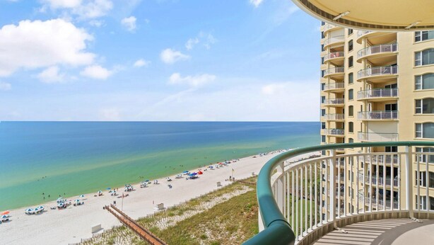 A high-rise building with balconies overlooking a beach. - Beach Colony East 9C (Pensacola)