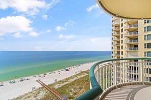 A high-rise building with balconies overlooking a beach. - Beach Colony East 9C (Pensacola)