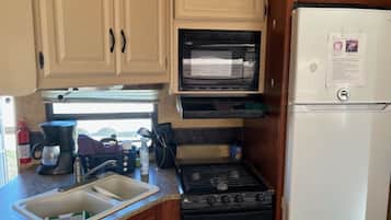 Fridge, microwave, oven, dining tables