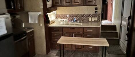 Fridge, microwave, oven, dining tables