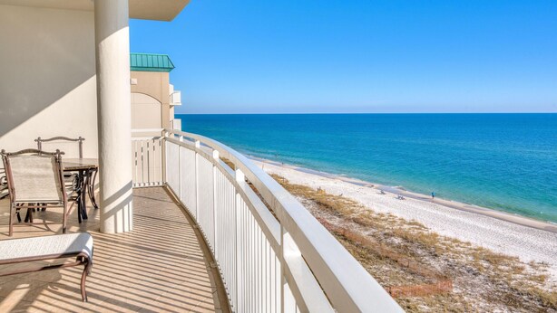 A balcony with a view of the beach and ocean. - La Playa 502 (Pensacola)