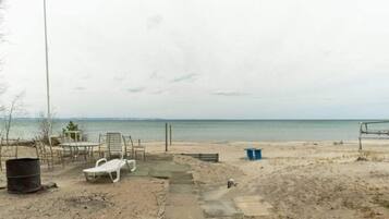 On the beach, sun-loungers, beach towels