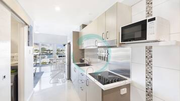 Fridge, microwave, stovetop, coffee/tea maker
