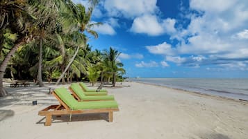 Private beach, white sand, sun loungers, beach towels