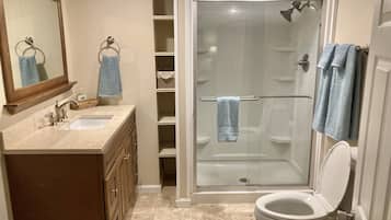 Shower, hair dryer, towels, soap