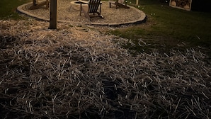 A gazebo with string lights, two Adirondack chairs, and a fire pit. - Modern Country Farmhouse, Walking Distance to Lake (Averill Park)