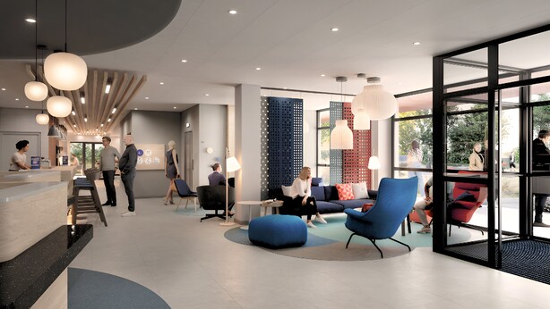A modern lobby with a reception desk, seating area with blue chairs, and large windows offering views of the outdoors. - Holiday Inn Express Caen Epron by IHG (Epron)