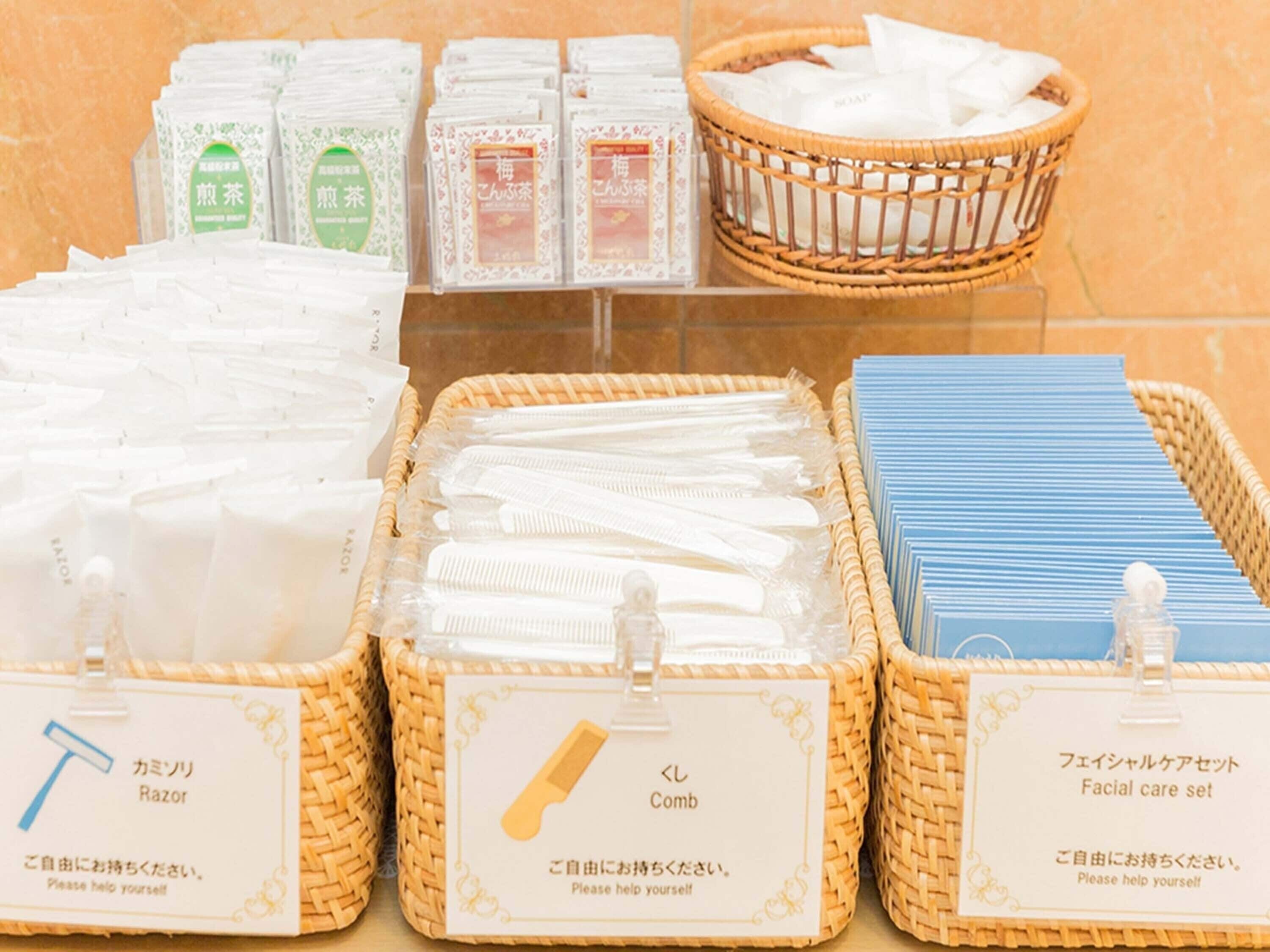 A display of personal care items including razors, combs, and facial care sets.