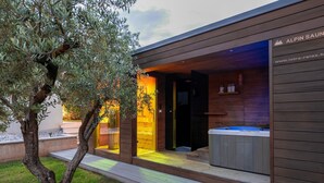 A modern spa building with a wooden exterior and a visible hot tub area. - Villa Panamera (Istria - Poreč) (Poreč)