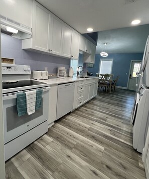 Fridge, microwave, oven, stovetop - Beachside Bungalow – Steps from the Beach (Cocoa Beach)
