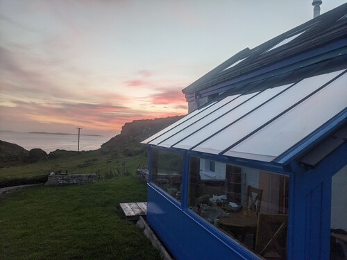 Idyllic Connemara cottage with sweeping sea, island and mountain views.