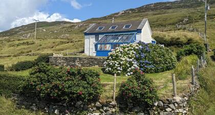 Idyllic Connemara cottage with sweeping sea, island and mountain views.